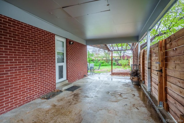 view of patio featuring fence