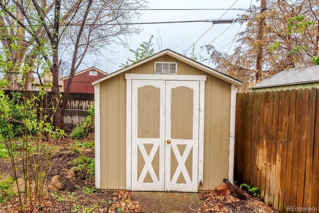 view of shed with a fenced backyard