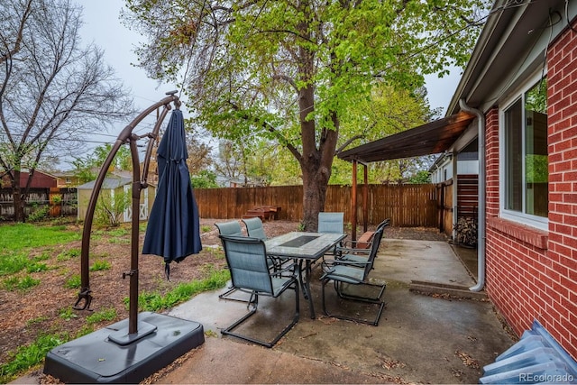view of patio / terrace featuring outdoor dining space and a fenced backyard