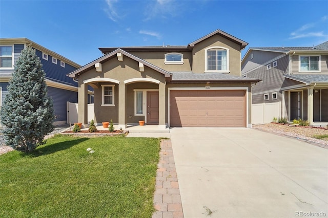 view of front of home featuring a garage and a front lawn