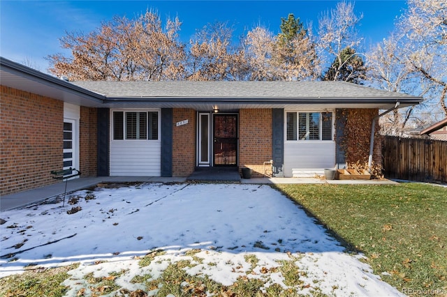 view of front of home with a lawn