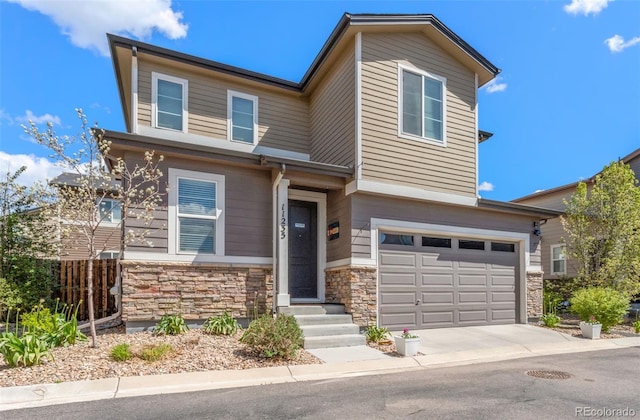 11235 S Neu Towne Cir, Parker, CO 80134 - view of front of house featuring stone siding, a garage, and concrete driveway