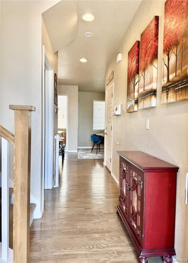11235 S Neu Towne Cir, Parker, CO 80134 - corridor with a textured wall, wood finished floors, a textured ceiling, recessed lighting, and baseboards