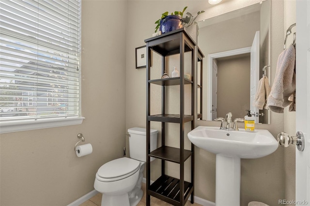 11235 S Neu Towne Cir, Parker, CO 80134 - half bath with toilet, baseboards, tile patterned floors, and a sink