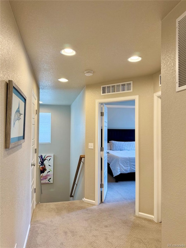 11235 S Neu Towne Cir, Parker, CO 80134 - hallway with an upstairs landing, carpet floors, recessed lighting, and baseboards