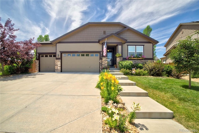25536 E 1st Ave, Aurora, CO 80018 - craftsman house featuring a garage, a front yard, concrete driveway, and stone siding