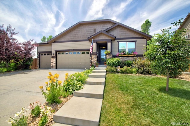 25536 E 1st Ave, Aurora, CO 80018 - craftsman house featuring a front lawn, concrete driveway, a garage, and stone siding