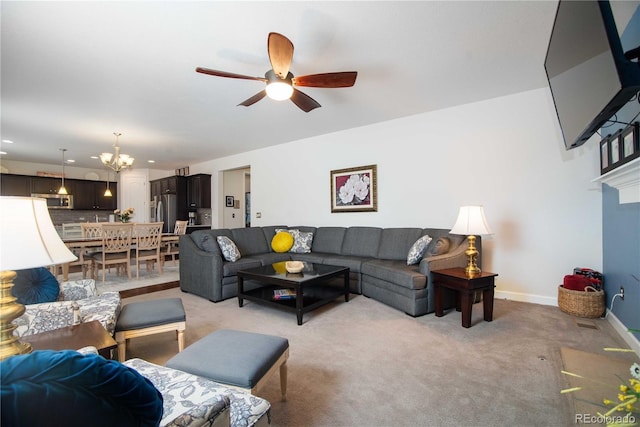 25536 E 1st Ave, Aurora, CO 80018 - living area featuring light colored carpet, a chandelier, ceiling fan, and recessed lighting