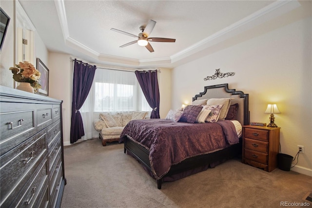 25536 E 1st Ave, Aurora, CO 80018 - carpeted bedroom with ornamental molding, a tray ceiling, and a ceiling fan