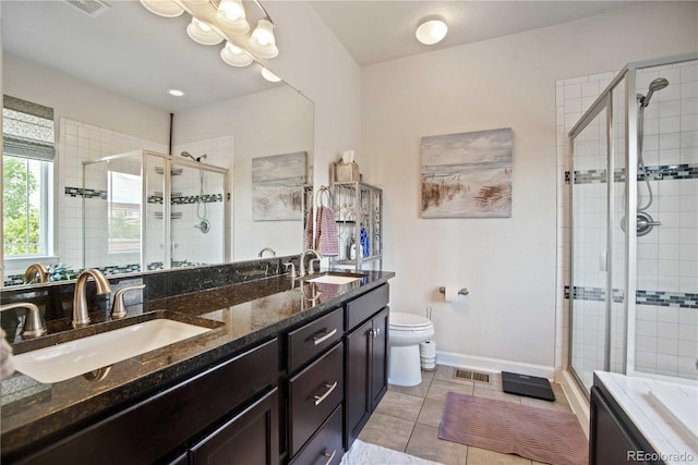 25536 E 1st Ave, Aurora, CO 80018 - full bathroom with a shower stall, double vanity, tile patterned flooring, and a bath