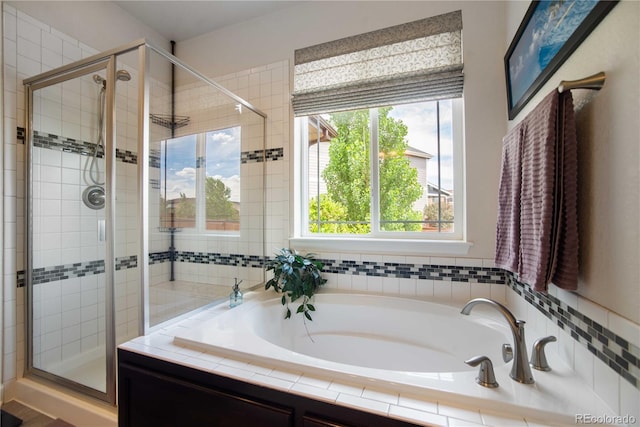 25536 E 1st Ave, Aurora, CO 80018 - bathroom featuring a shower stall and a garden tub
