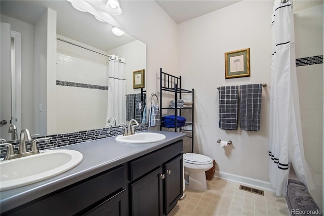 25536 E 1st Ave, Aurora, CO 80018 - bathroom with double vanity and toilet
