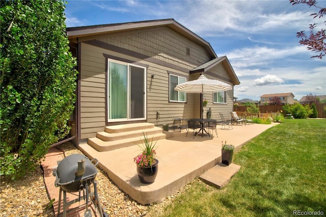 25536 E 1st Ave, Aurora, CO 80018 - rear view of property with a patio area