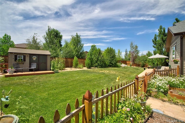 25536 E 1st Ave, Aurora, CO 80018 - fenced backyard featuring an outbuilding and a deck