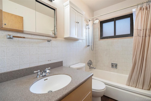 bathroom featuring vanity, toilet, and shower / bath combo with shower curtain