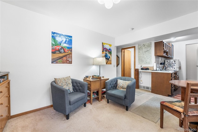 living area featuring light colored carpet