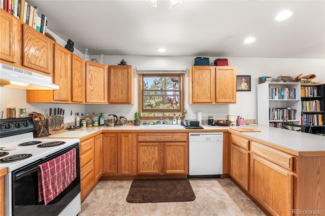 kitchen with white appliances, sink, kitchen peninsula, and light tile patterned flooring