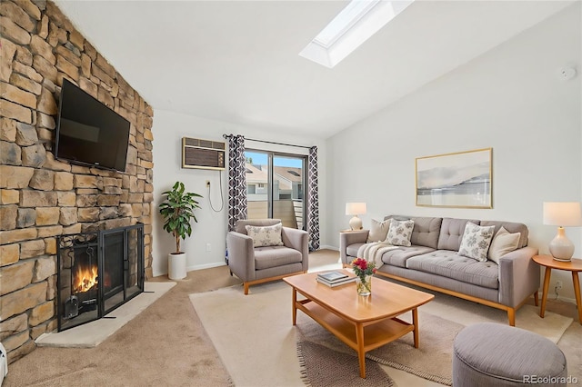 10150 E Virginia Ave Unit 7-302, Denver, CO 80247 - living area featuring a wall mounted air conditioner, lofted ceiling, a skylight, carpet, and a fireplace