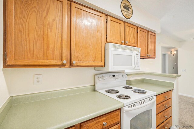 10150 E Virginia Ave Unit 7-302, Denver, CO 80247 - kitchen featuring white appliances, light countertops, carpet, brown cabinets, and baseboards