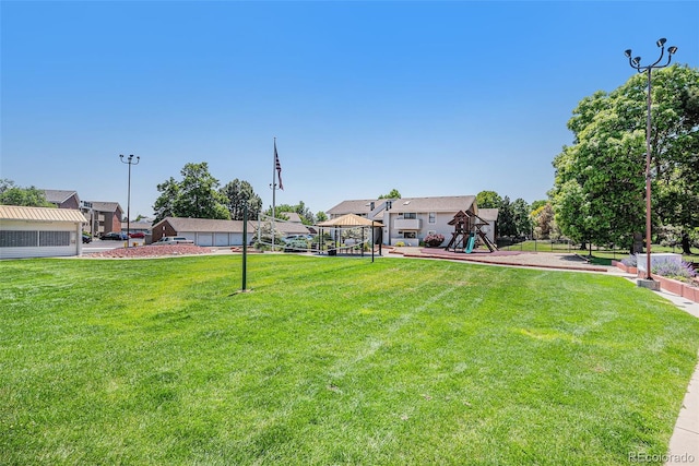 10150 E Virginia Ave Unit 7-302, Denver, CO 80247 - view of green lawn featuring a residential view