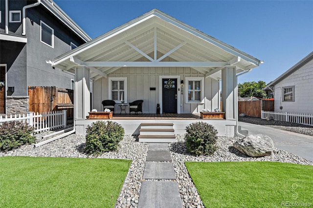 view of front of home with a front lawn and a porch