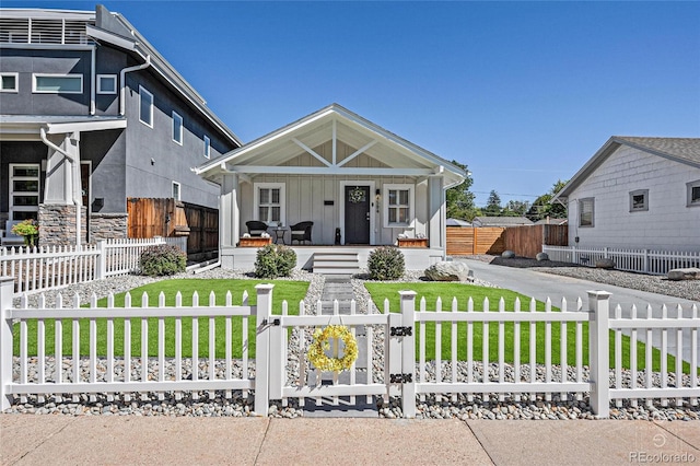 view of front facade with covered porch and a front lawn