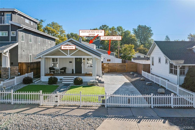 view of front of house with covered porch and a front lawn