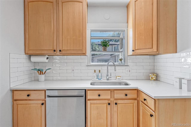 kitchen with decorative backsplash, dishwasher, sink, and light brown cabinetry