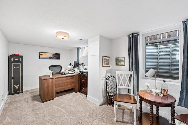 office area featuring light colored carpet