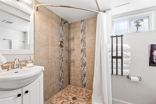 bathroom with vanity and curtained shower