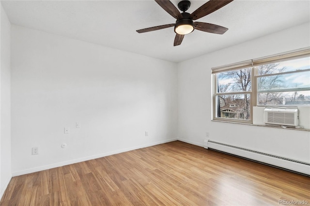 empty room featuring a baseboard heating unit, cooling unit, ceiling fan, and light hardwood / wood-style flooring