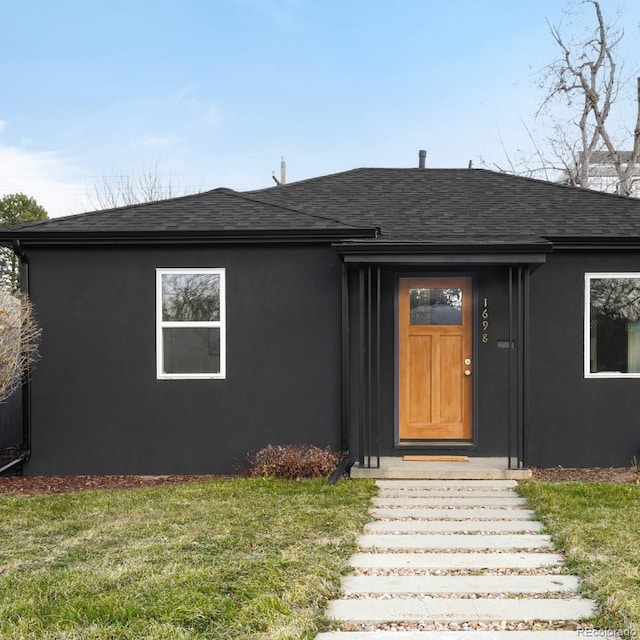 property entrance with a yard