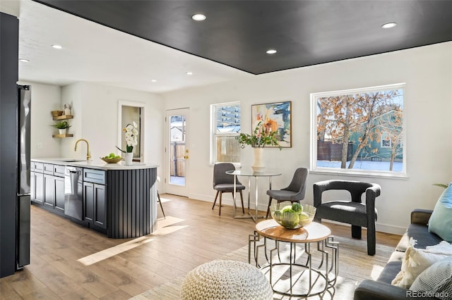 interior space with sink and light hardwood / wood-style floors