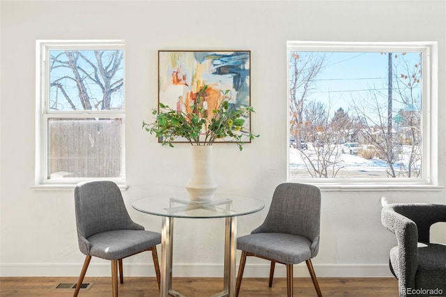 dining area featuring hardwood / wood-style floors