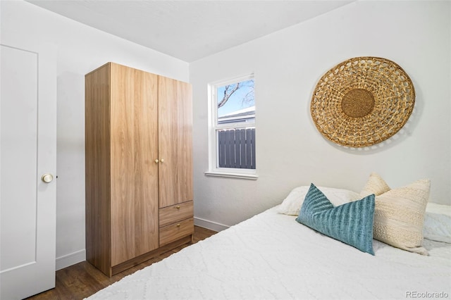 bedroom featuring dark wood-type flooring