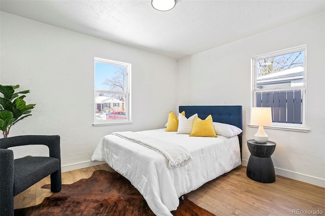 bedroom with wood-type flooring