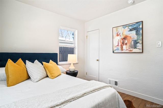 bedroom with wood-type flooring