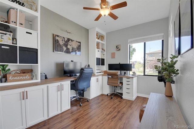 18085 E 107th Pl, Commerce City, CO 80022 - office space featuring a ceiling fan, wood finished floors, baseboards, and built in features