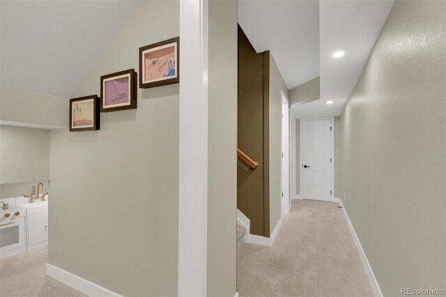 18085 E 107th Pl, Commerce City, CO 80022 - hall featuring light colored carpet, baseboards, vaulted ceiling, and recessed lighting