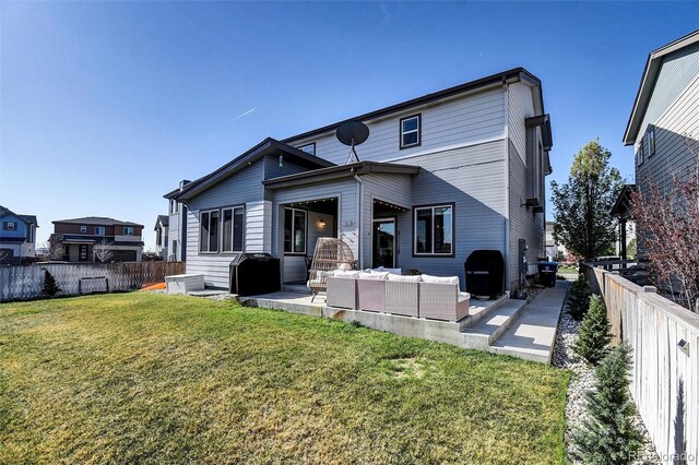 18085 E 107th Pl, Commerce City, CO 80022 - back of property featuring an outdoor hangout area and a patio