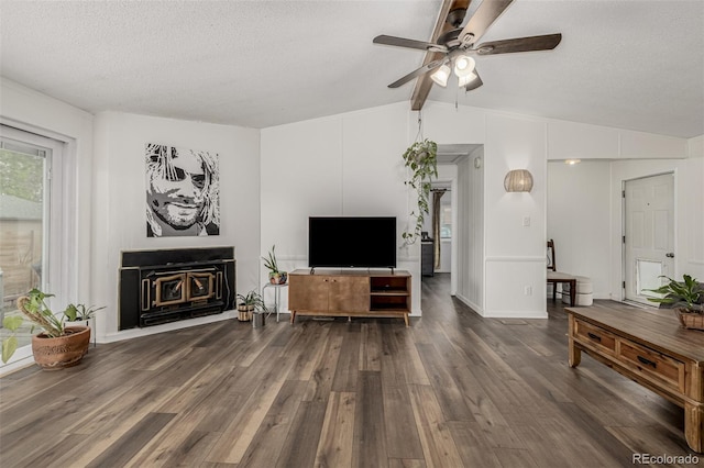 5532 Umatilla St, Denver, CO 80221 - living area with wood finished floors, a ceiling fan, a textured ceiling, and a fireplace