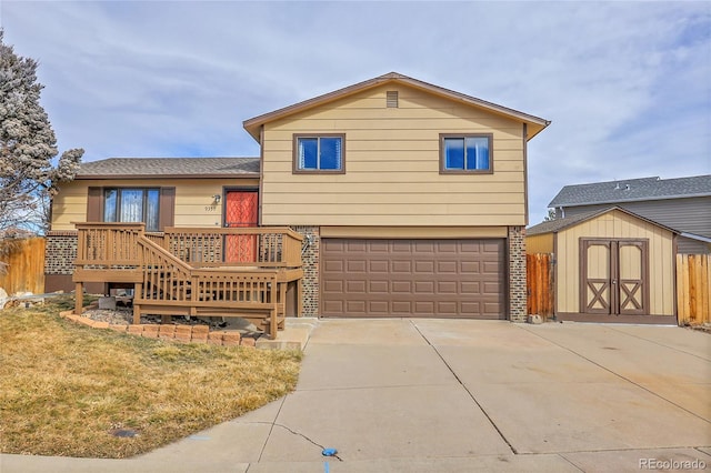 view of front of property with a garage, a storage unit, and a front yard