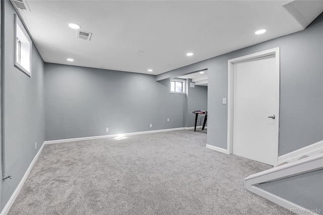 basement with light colored carpet