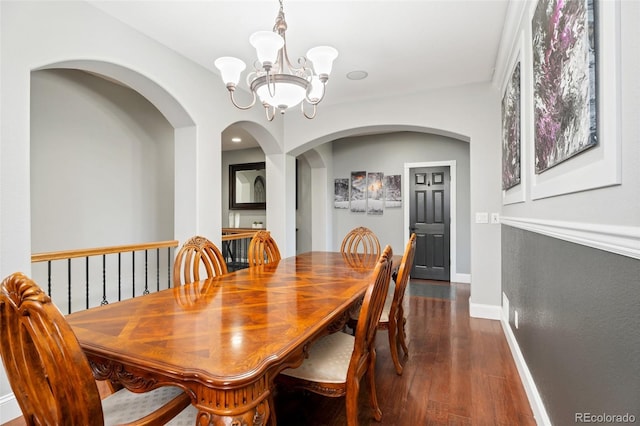 dining room featuring a chandelier and dark hardwood / wood-style floors