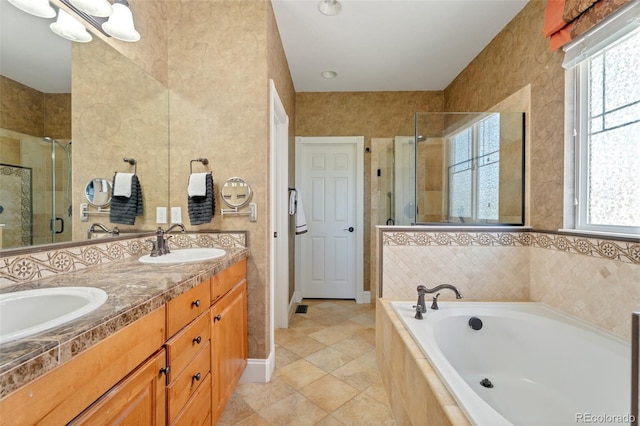 bathroom with plenty of natural light, vanity, independent shower and bath, and tile patterned flooring