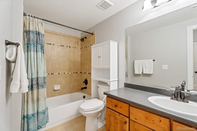 full bathroom with tile patterned floors, shower / tub combo with curtain, vanity, and toilet