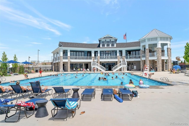 view of swimming pool featuring a patio area