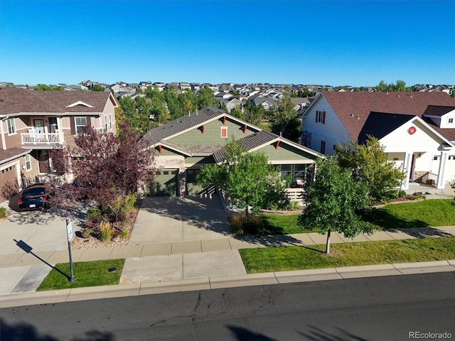 6988 S Riverwood Way, Aurora, CO 80016 - view of front facade with a residential view, driveway, and an attached garage