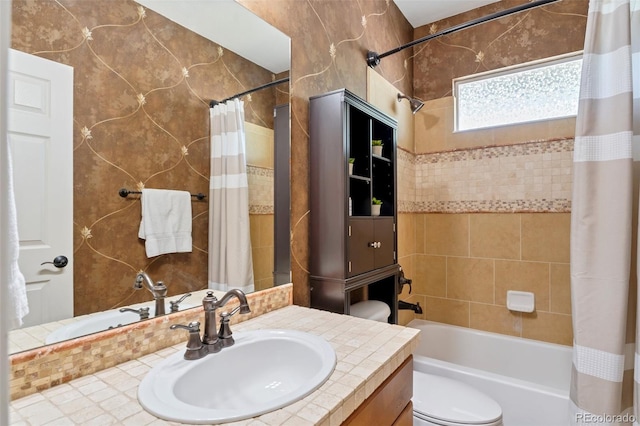 full bathroom featuring shower / bath combo, toilet, and vanity