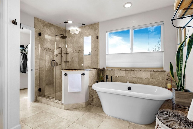 bathroom with tile patterned flooring and plus walk in shower